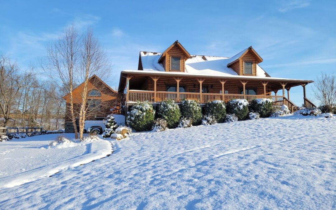 Photo of log home in the snow