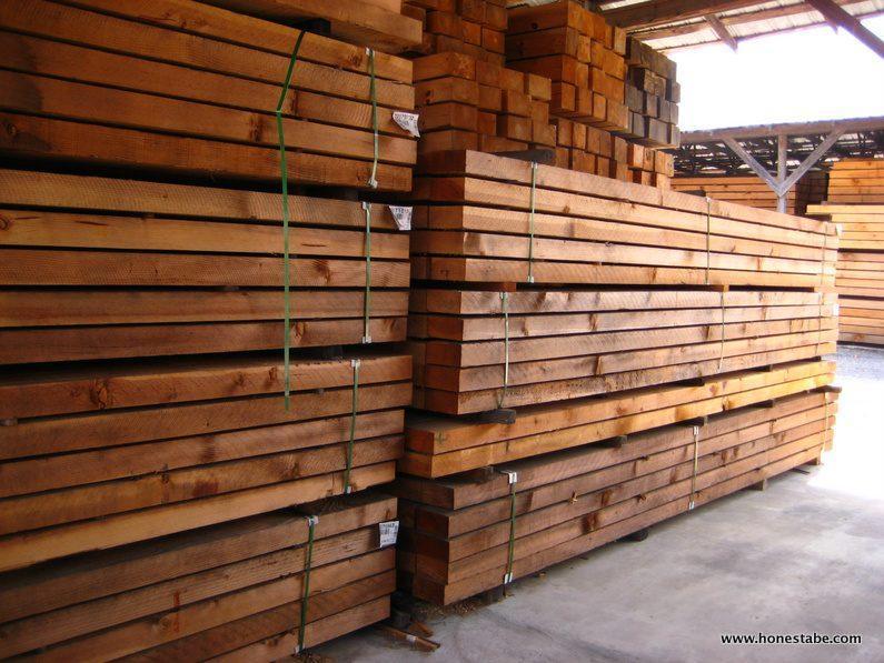 photo of logs stacked in the warehouse of the Mill at Moss, TN, Honest Abe Log Homes