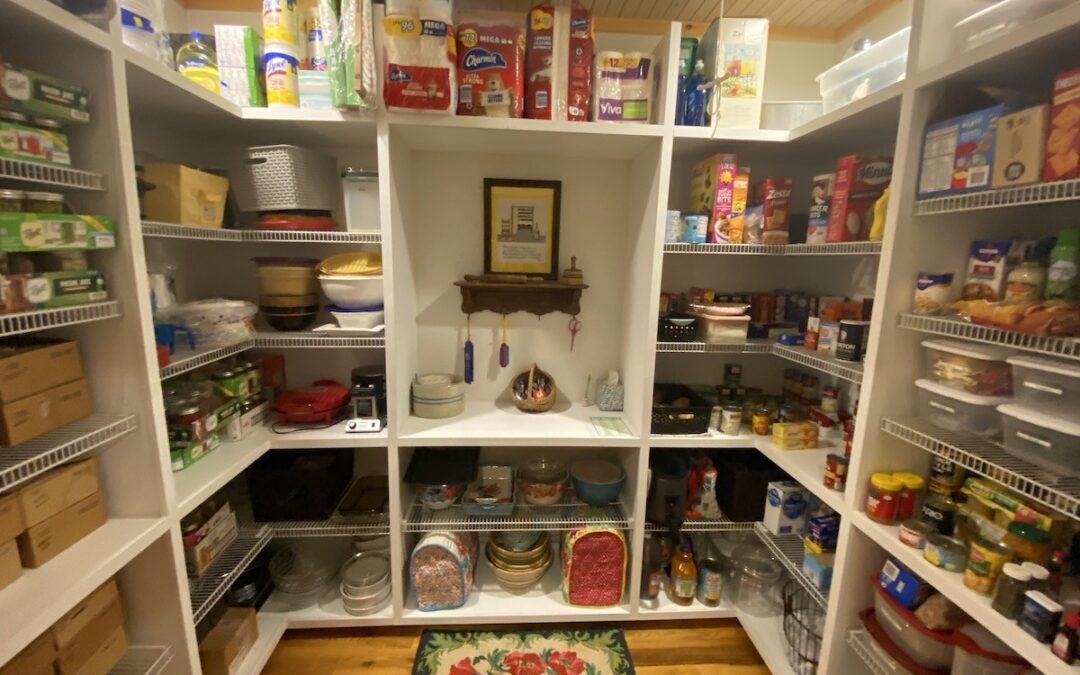 Photo of walk in pantry with wood floor and whitewashed wood ceiling